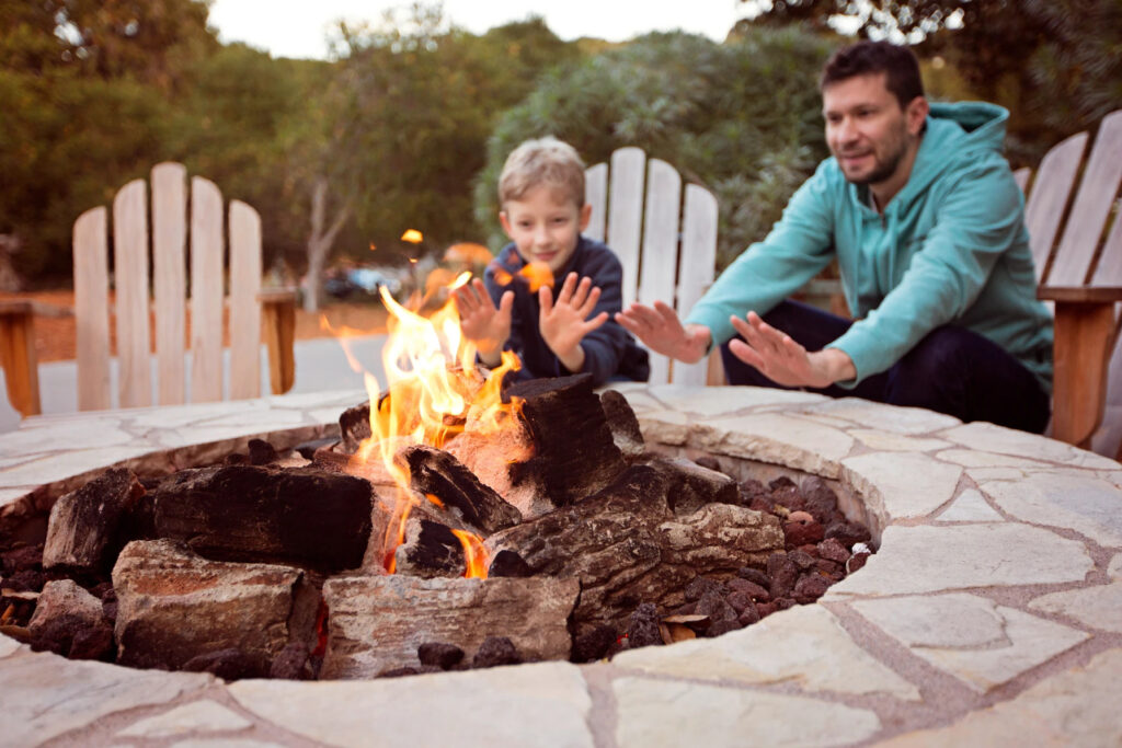 father and son by fire pit