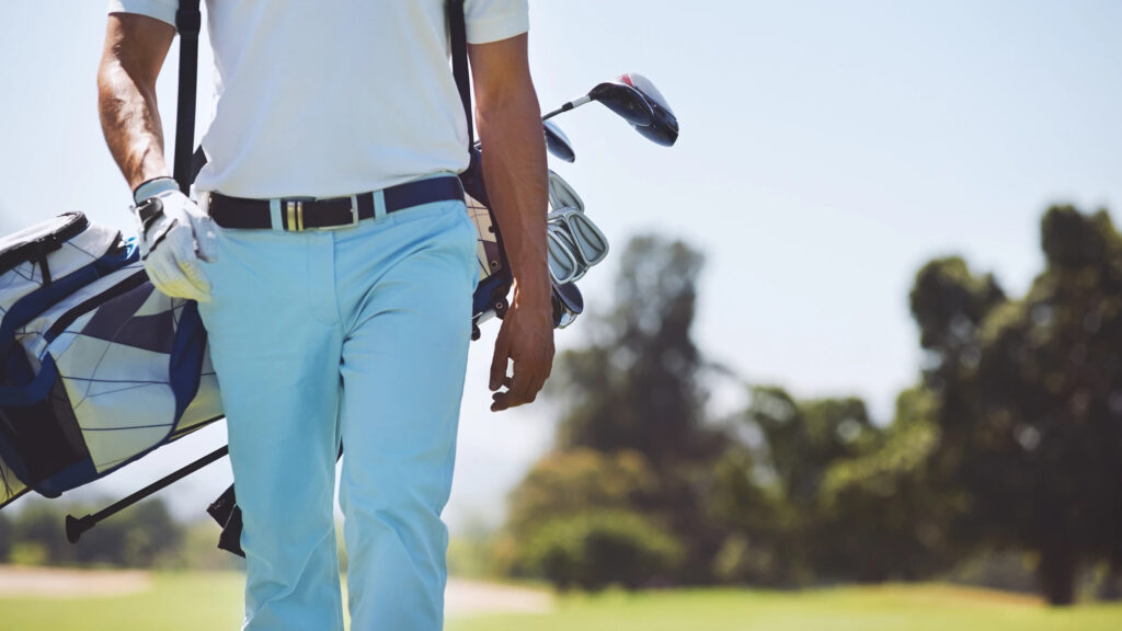 man with golf gear and gadgets