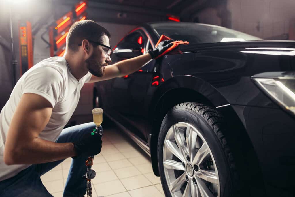 man working on car