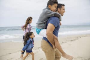 family walking beach