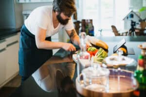 man cooking healthy meals